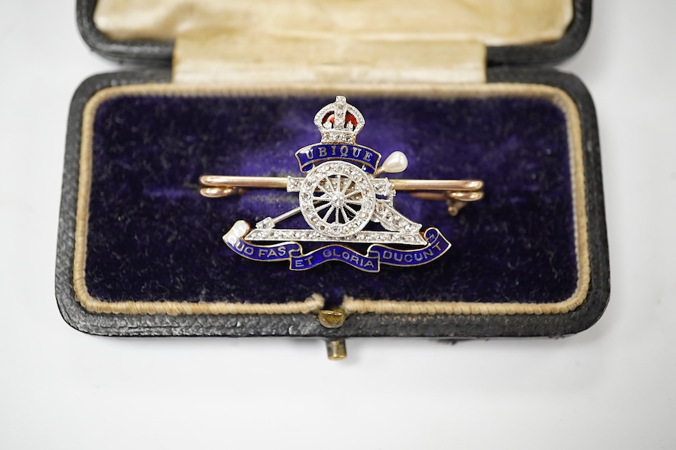 A cased early 20th century 9c, enamel and diamond set Royal Artillery sweethearts brooch, 37mm, gross weight 6.3 grams. Condition - good